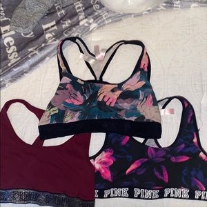 Three pink sports bras